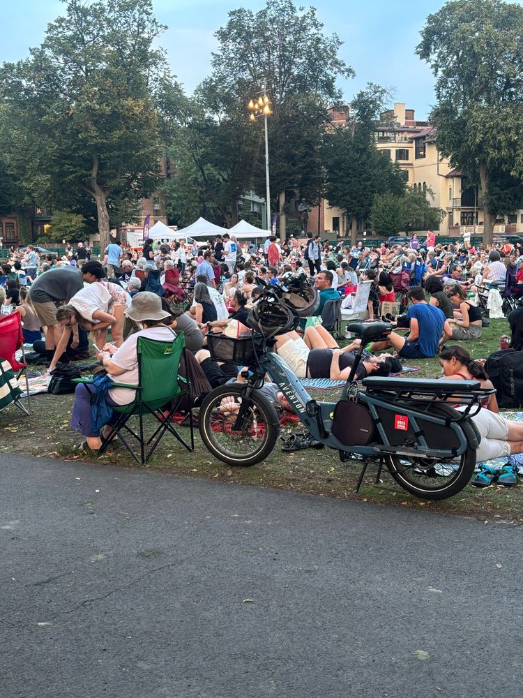 Aventon Abound cargo bike with a crowd in the back