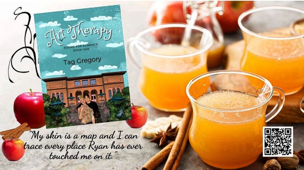 Book title: Art Therapy by Tag Gregory. Quote: “ my skin is a map and I can trace every place. Ryan has ever touched me on it.” Book set amid a table filled with mugs of cider, apples & cinnamon.