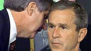 Andrew Card telling GW Bush that a 2nd plane has struck the WTC on 9-11