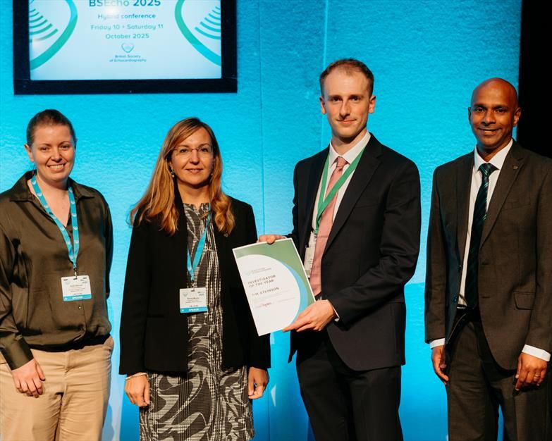 A picture of Tim accepting his award from Sadie Bennett, Denisa Muraru and Dan Augustine
