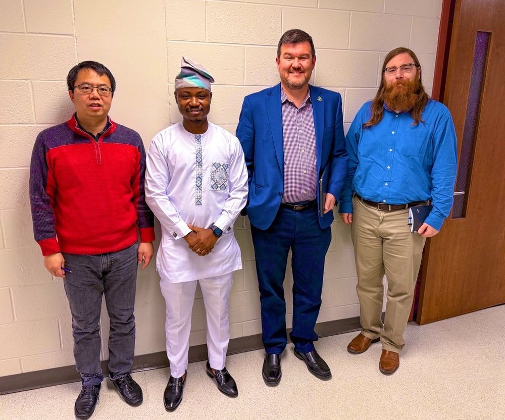 New PhD, Dr. Isaiah Adelabu with his dissertation committee 