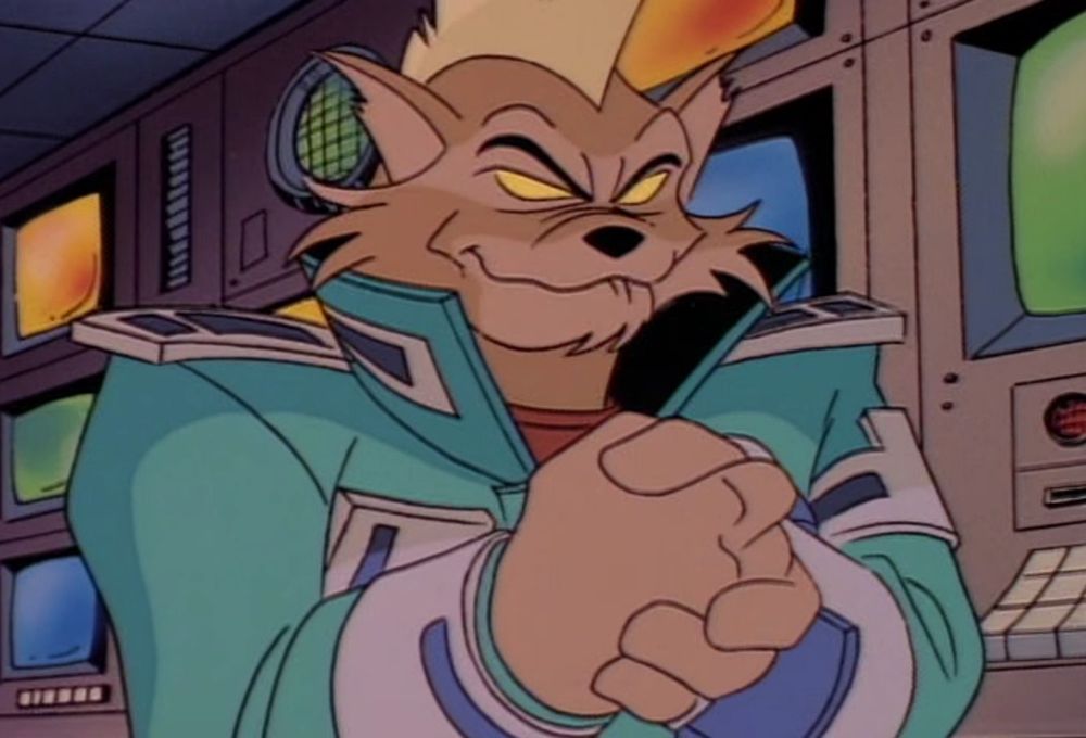 An anthropomorphic cat with a blonde mohawk, wearing a blue coat with the biggest shoulder pads you’ve ever seen