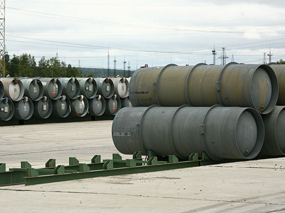 A ground-level shot of 48Y uranium hexafluoride storage containers at another outdoor location. These are probably storing depleted UF6, as some of them have a patina of rust, indicating that they've been outdoors for a while.