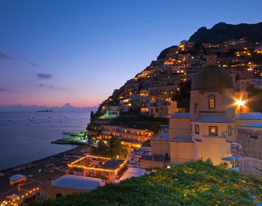 This image shows the Italian town of Positano, located on the Amalfi coast south of Naples, at night.