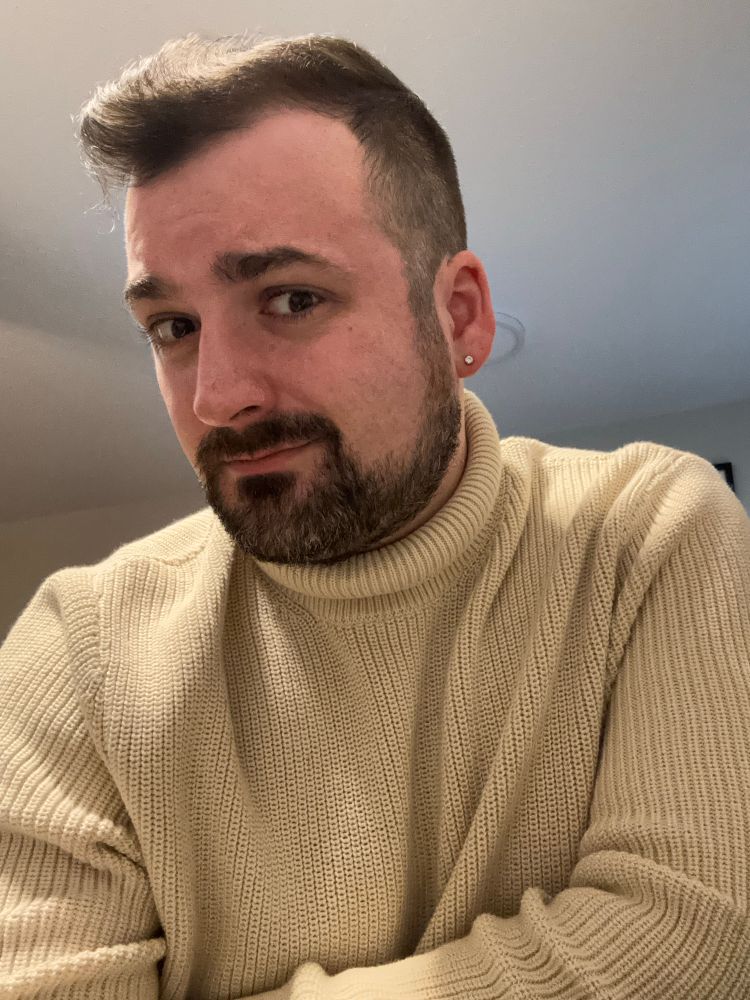 A handsome lil editor wearing a turtleneck