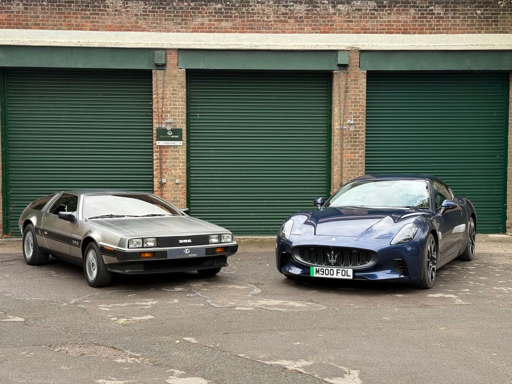 A photograph of a converted DeLorean sports car and a Maserati Folgore, both electric