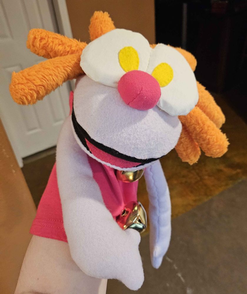 a hand puppet of notsweetdandy's character, Mumbles. he's missing his hat, which i still need to find trimming for. his hands may or may not end up having real shitty arm rods put in em.