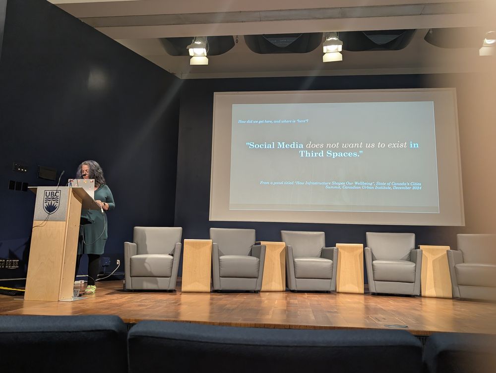 Johanna on stage with this quote on a slide 