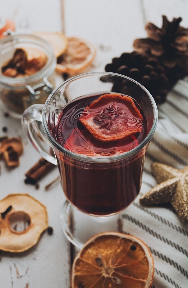 Glass of mulled wine surrounded by spices and dried fruits. Image from Pixabay, by Be_Stasya. Canon EOS 2000d