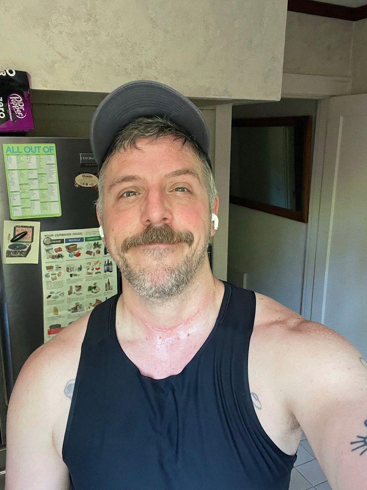 a picture of a man who is sweaty. he is a sweaty man, as it were. he boldly declares, i am sweaty. 