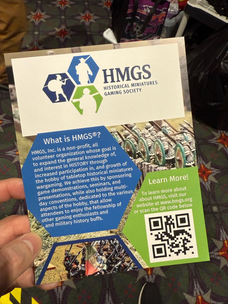 A photo of a flyer promoting the Historical Miniatures Gaming Society (www.hmgs.org)