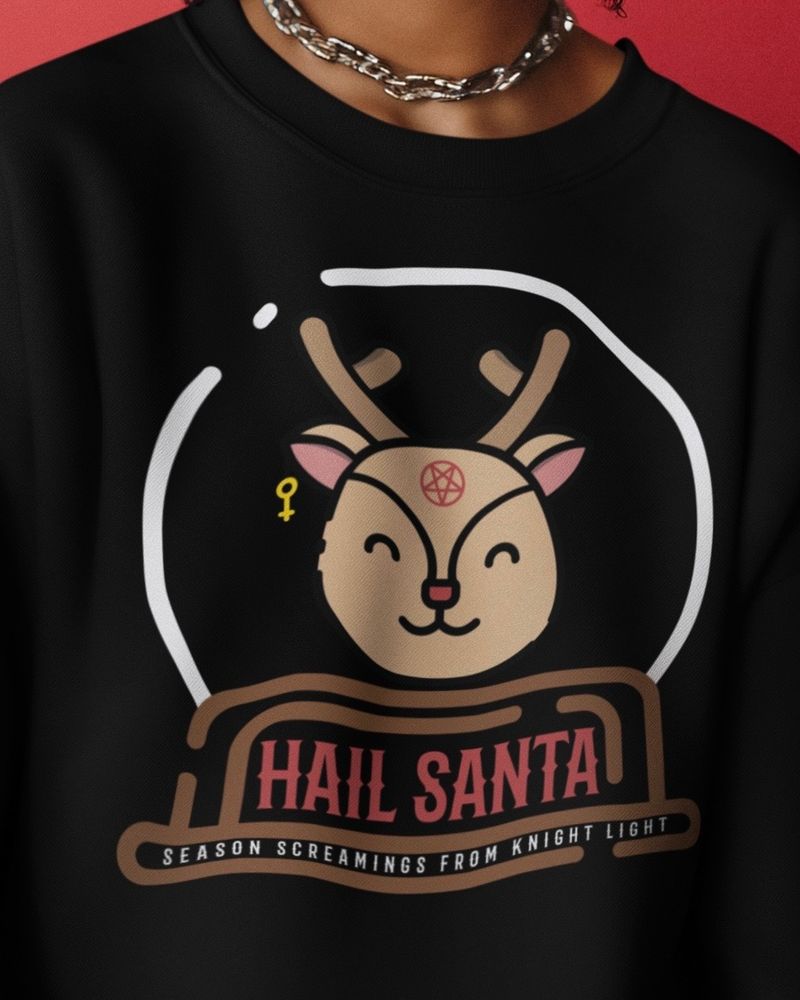 Black sweater with a reindeer that has an upside-down cross earring and a pentagram on his forehead. The text says "Hail Santa" & "Season screaming from Knight Light"