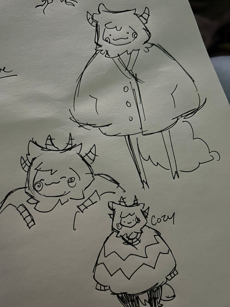 Three fluffy monsters smiling in cozy sweaters