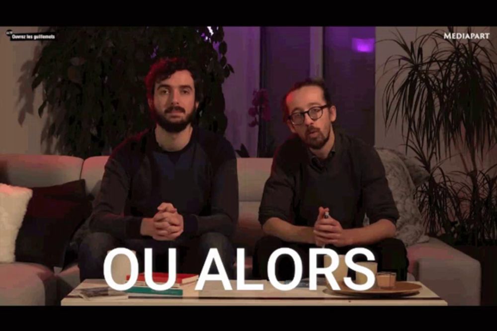 two men sitting on a couch with the words ou alors written on the screen