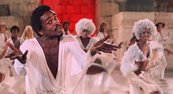 Carl Anderson as Judas in "Jesus Christ Superstar, with backup singers and dancers.
Christianity is properly a religion of heretics and heresy. Whatever a Christian believes, the majority of Christians will find something about it to be heretical. There is no orthodox. There is only heresy and either the graceful acknowledgement or brutish denial of one's own status as a heretic.