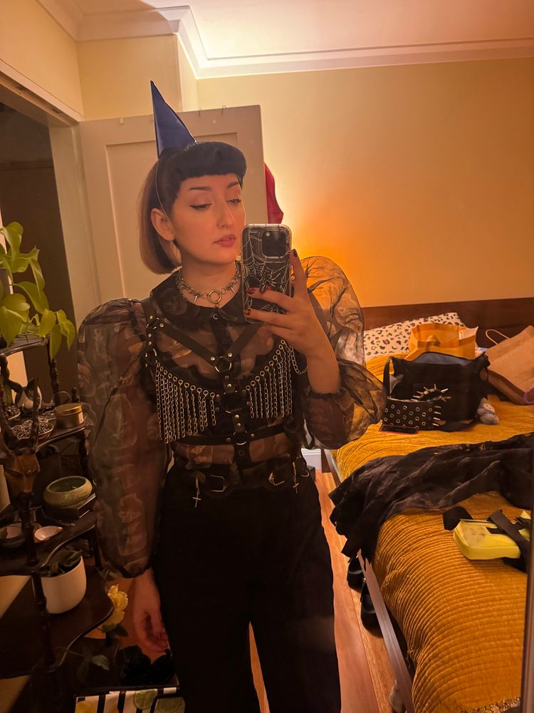 Sophie mirror selfie in party clothes and party hat