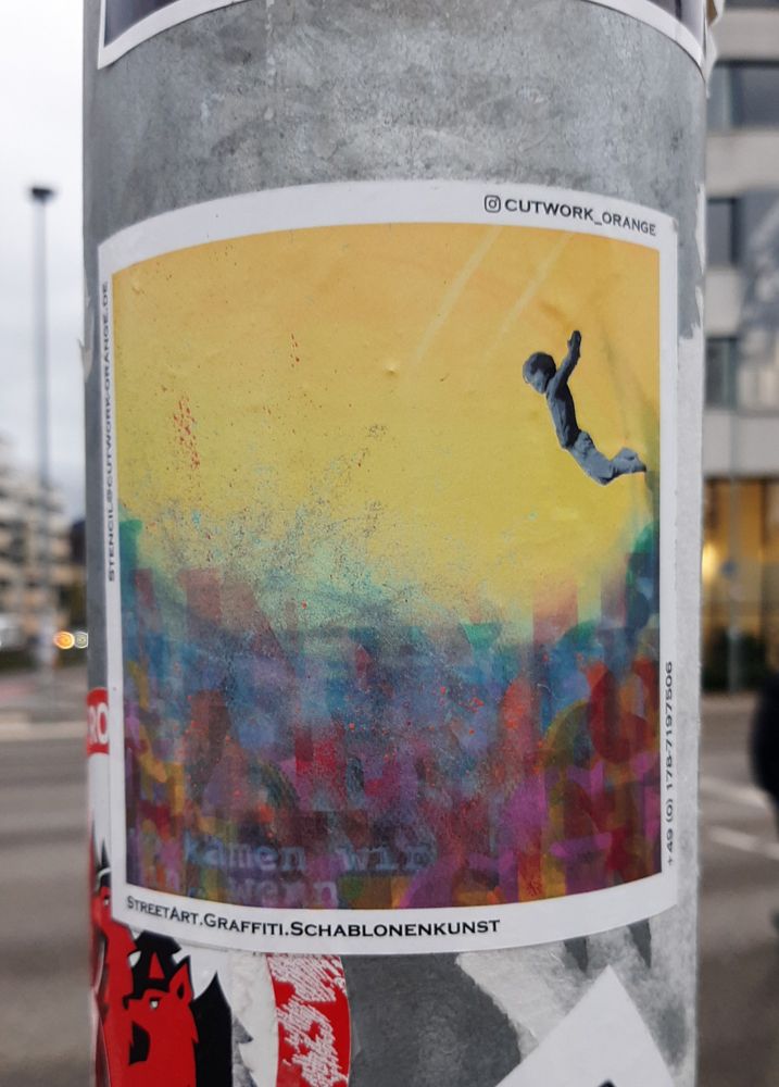 Photo of a street stick with a boy jumping in a sea of colours