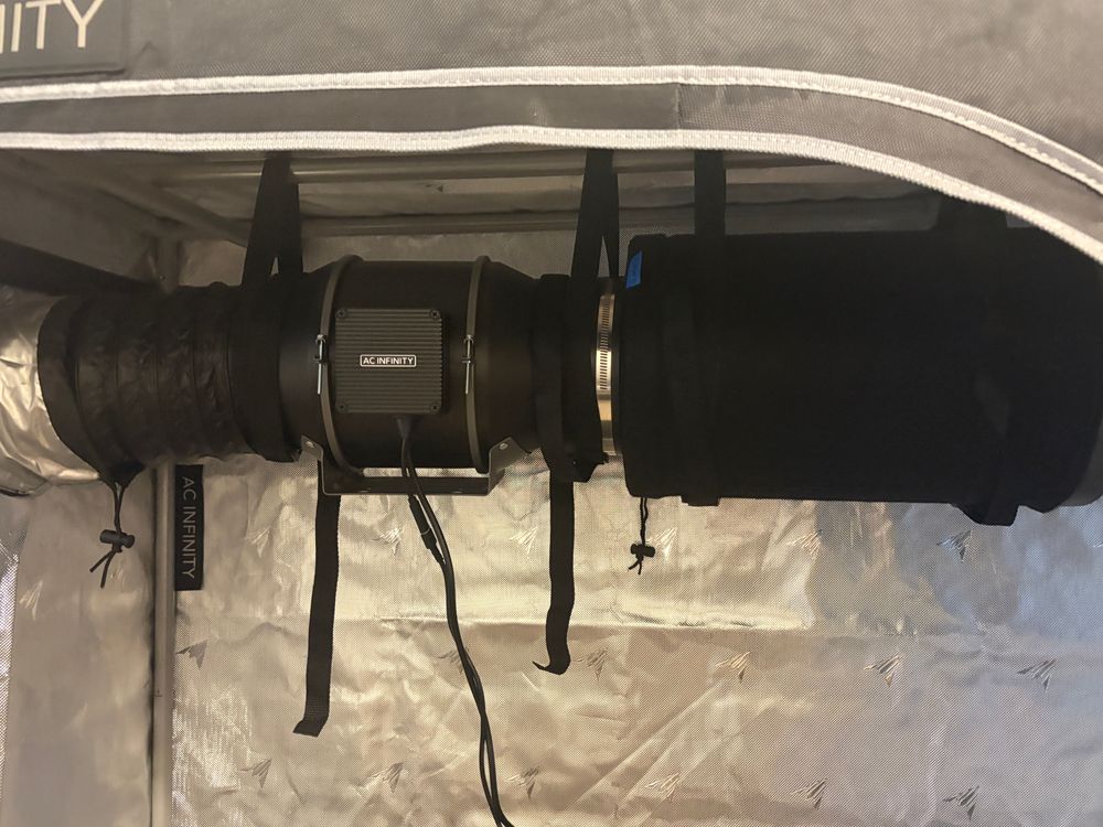 From right to left the AC Infinity Air 6" Carbon Filter is connected via a noise reduction clamp (also AC Infinity) to the AC Infinity CLOUDLINE PRO T6 Inline Duct Fan which is connected to an AC Infinity duct.