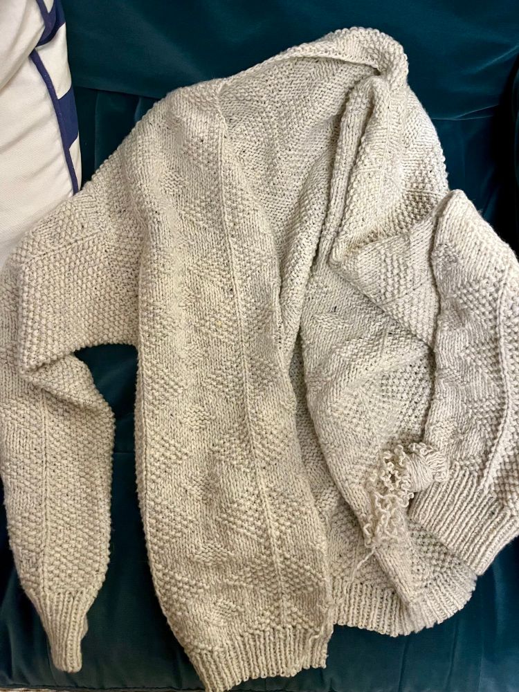 Basically finished sweater with the bottom ribbing being ripped out.