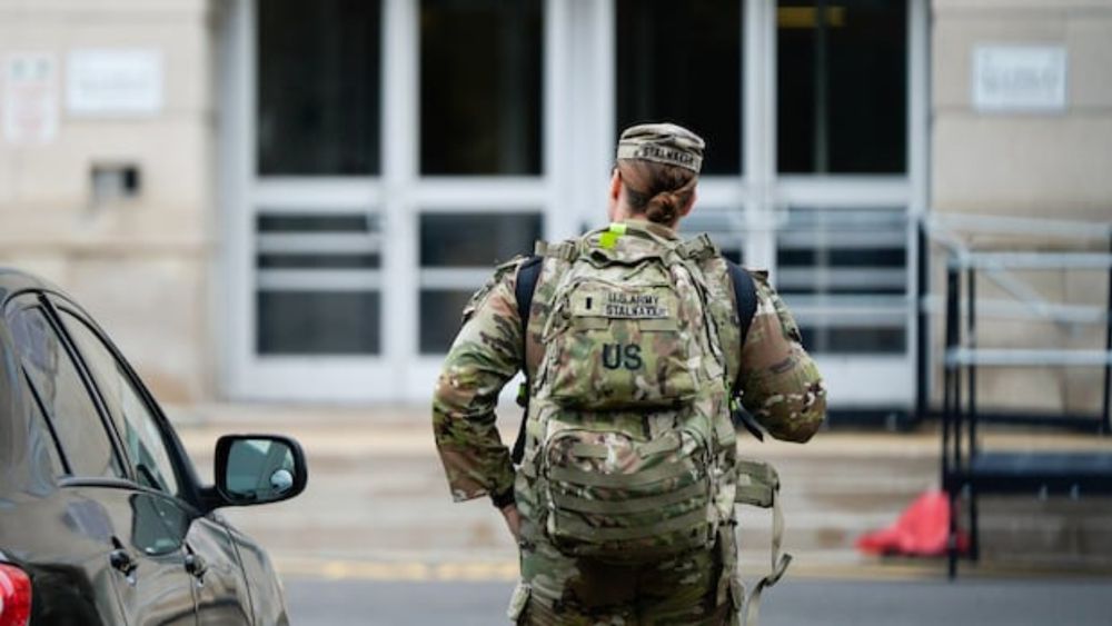 The new picture of law enforcement in the U.S. capital began taking shape Tuesday as some of the 800 U.S. National Guard members deployed by the Trump administration began arriving.