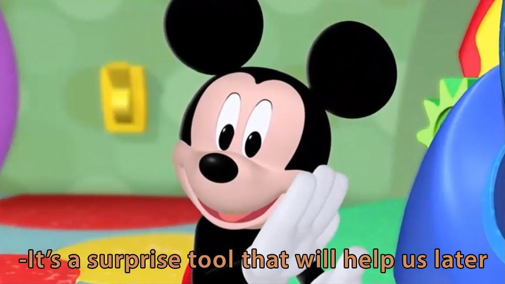 A picture of Mickey Mouse whispering to the camera "it's a surprise tool that will help us later"