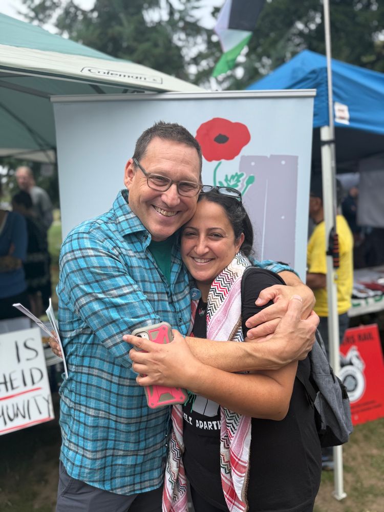 Avi and Jeeda in a smily embrace at Burnaby’s Labour Day BBQ