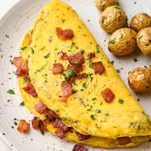 a fancy lookin omelette, by fancy i mean theres some green shit on it
