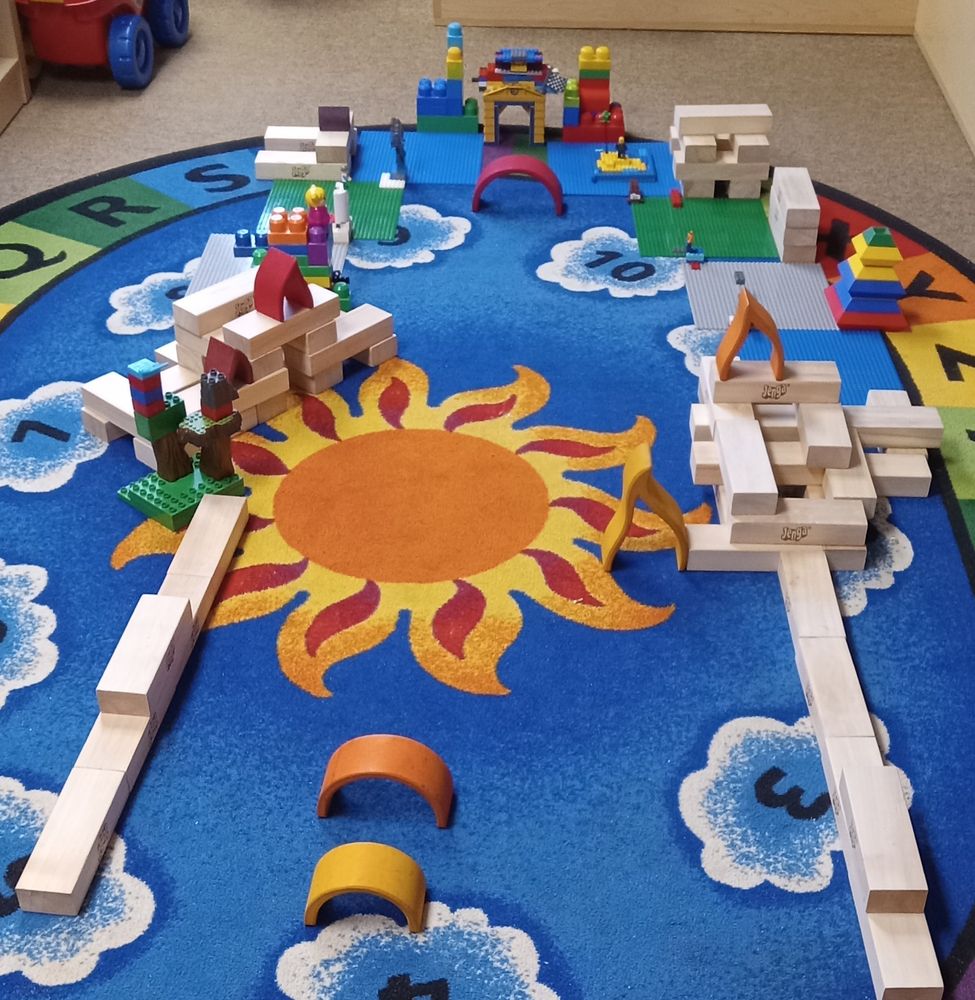 Mini putt hole with a building block theme