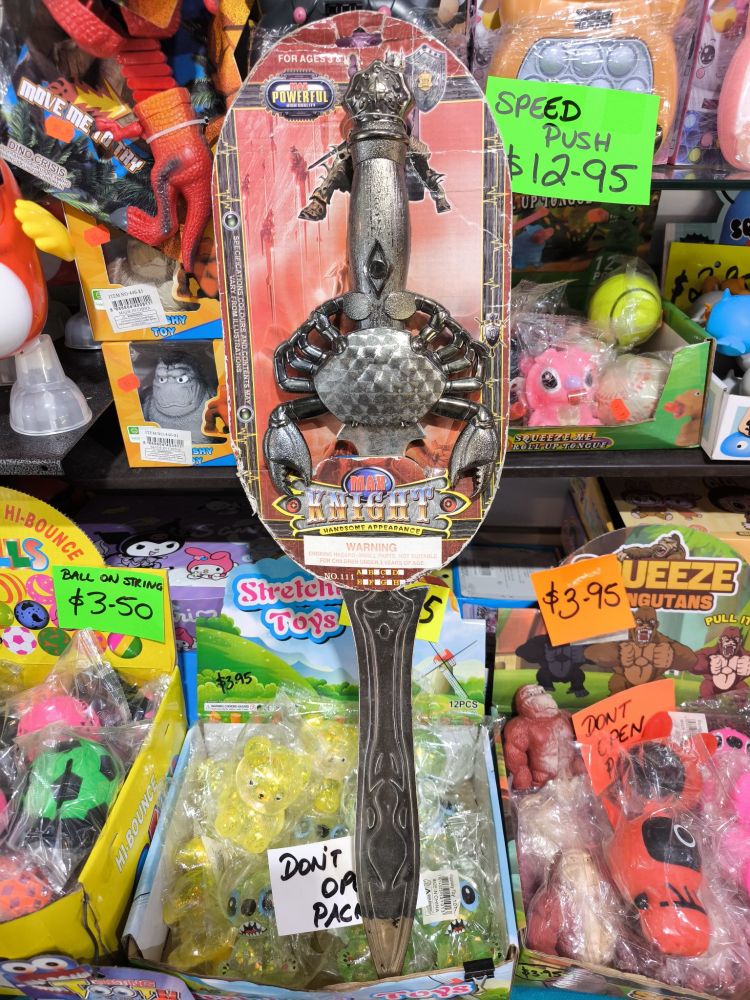 Crab Sword. It is a sword with a fake metal crab on the hilt. The logo reads "MAX KNIGHT: HANDSOME APPEARANCE". For ages 3 & up.