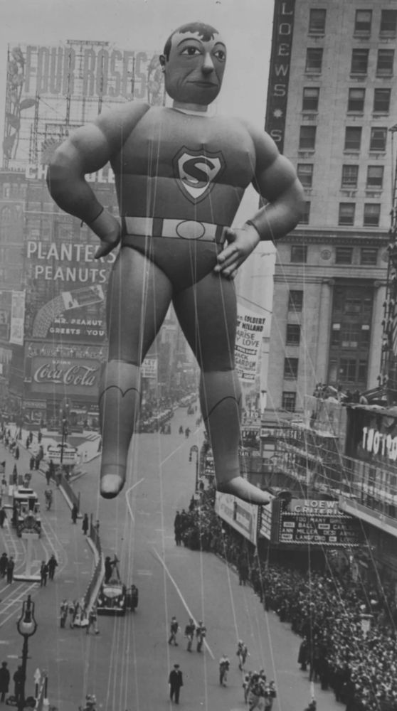 Black and white photo of an Old Macy’s day parade Superman balloon. It looks very fucked up 