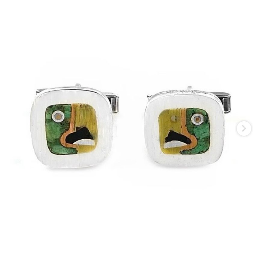 Perhaps Chato's most famous design, the 'perfil de perico' (parakeet in profile) aka 'cubist parrot' to American collectors - I've seen literally hundreds of examples of this design used in cufflinks, bracelets, belt buckles, earrings, pins, tie bars, tie tacs, even a compact, etc, but this is the only example that I have seen marked with Chato's mark - "Chato Castillo", all others have been marked for "Los Castillo" etc - this design famously won first prize at the Taxco Silver Fair in 1953, and with Chato's marks this pair must be from right around that time - marks include "Chato Castillo 925 Taxco Mexico" but no Eagle mark - measure 3/4" square and weigh a hefty 16 grams for the pair - Some sellers assume that because an item doesn't have an Eagle mark (or a later T mark) that it's ONLY pre-Eagle 1940s vintage, but this is not always (or even mostly) the case from my experience - in a great number of cases it's because the maker didn't have their own Eagle or registry mark, and the pieces without these marks can be from all eras ie 1940s to the present, and the circa must be determined from a number of other factors including the design, construction, any provenance that came with the piece, and patina examined with a loupe.
This design is constructed using four metals ie silver, brass, copper, and dark silver (a colored alloy of silver), along with two stones ie black onyx and azurmalachite inlay.
Chato won first prize in the Taxco Silver Fair for this design in 1952, and famous Mexican modernist artist Rufino Tamayo was a judge that year, and he presented Chato with a drawing of Chato's design that he had done because he so greatly admired Chato's design! The drawing is pictured in the original "Mexican Silver" book by Morrill and Berk.