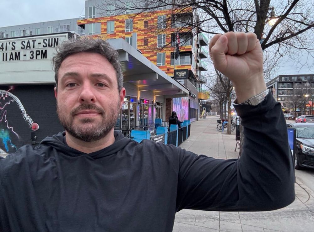 Me raising my fist outside the Uptown VFW in Minneapolis 