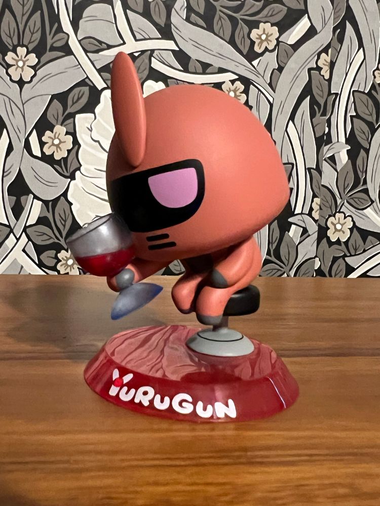 Char's Zaku offering a toast to friends. 