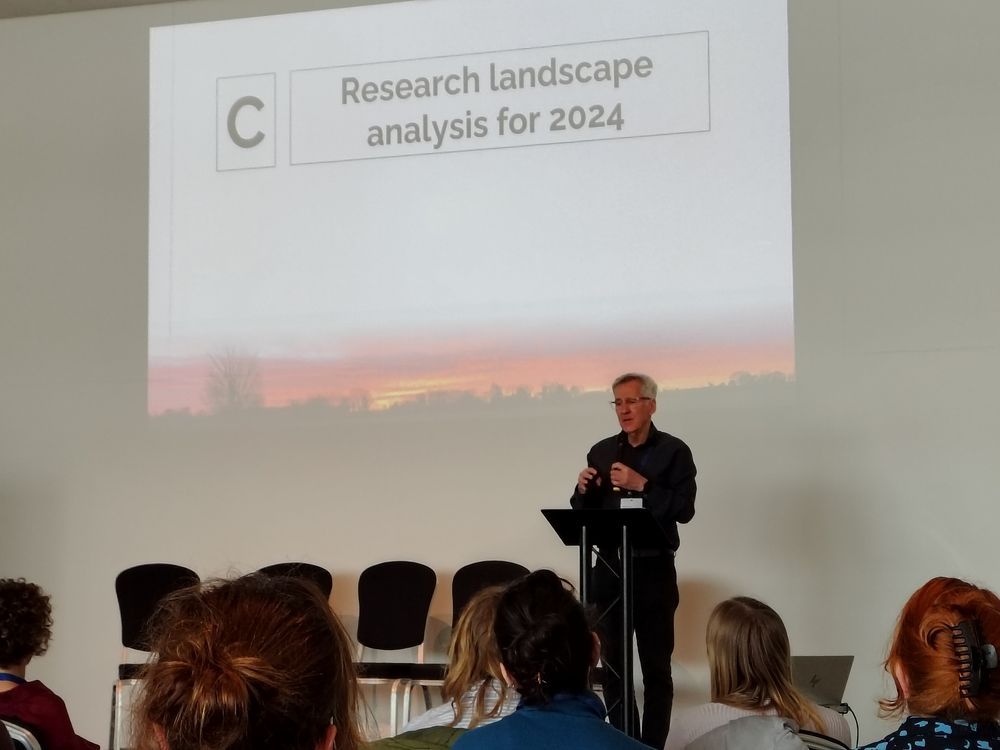 Image of Martin Knapp presenting on a stage