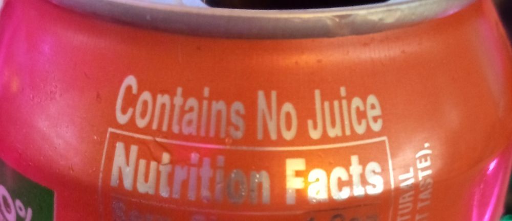 the side of a can reads "Contains No Juice"