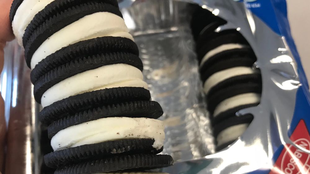 A sleeve of Oreo cookies with an excessive amount of crème filling.