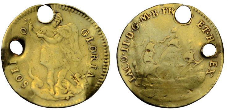 Gold piece from the royal touching ritual, pierced twice for suspension (presumably because the first hole was too close to the edge). Obv.: St Michael vanquishing the dragon, with the legend SOLI DEO GLORIA ('The glory to God alone'). Rev.: a three-masted ship, with the king's titles (IACO. II. D. G. M. B.  FR. ET HIB. REX - James II by the grace of God, King of Great Britain, France and Ireland') 