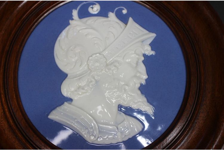 Pair of round glazed blue and white portrait plaquettes of a helmeted Renaissance warrior (here) and lady in wood frames, marked on the underside with 'Sgr P' and a sceptre. The seller's justification was that the description stated they are in Wedgwood's characteristic blue but not marked Wedgwood - but Jasperware they are not and I don't think that's Sarah Siddons. To be fair, though, the description was later amended to identify the maker correctly