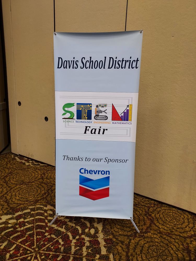 A banner for the Davis School District Science Technology Engineering Mathematics (STEM) Fair. Sponsored by Chevron.