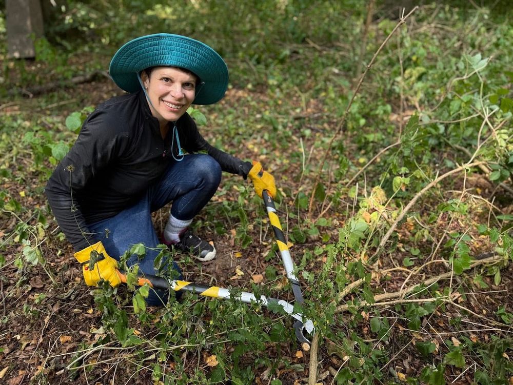 Me cutting down greenery in a Jewish cemetery