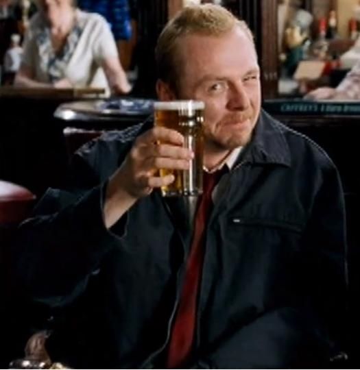 Simon Pegg hoisting a beer in Shaun of the Dead