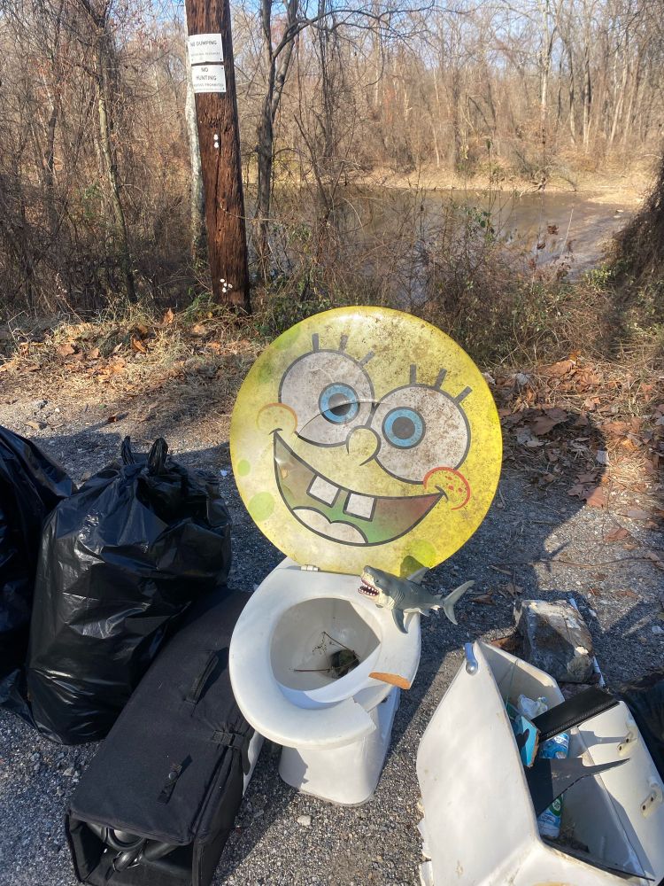 Sharkey sits on a toilet with a huge Sponge Bob face for a lid. 