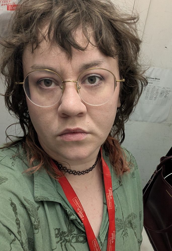 selfie of me in a dragonfly button up with shaggy hair