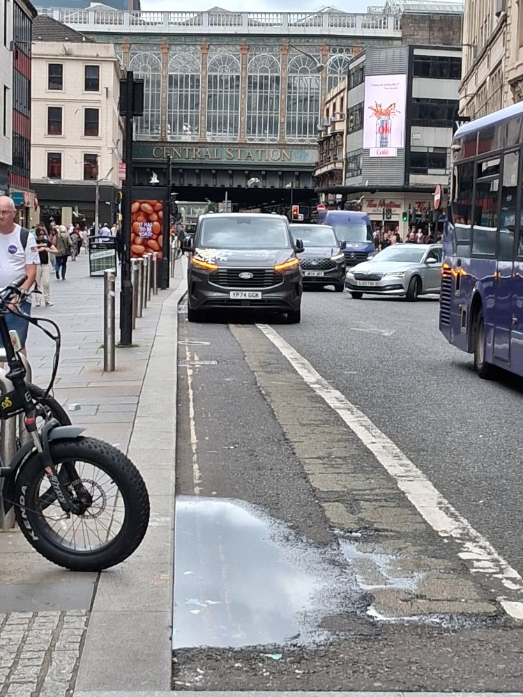 Van parked in same bike lane, flashing indicators show that they have permission to be there.*   obviously untrue 