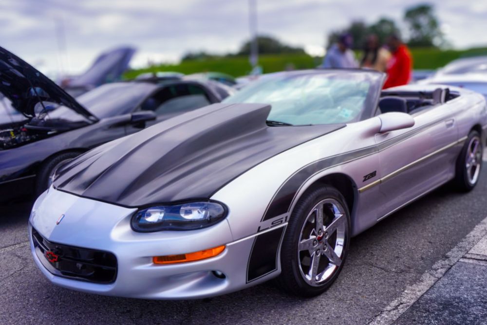 A silver and black Camaro. 