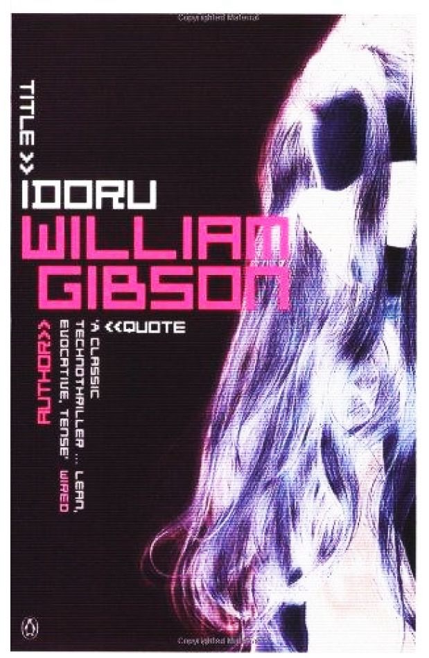 A cover of William Gibson's novel Idoru. Its style is modern with blocky computer style fonts, and the image in the back is a negative closeup of a woman's face in profile.