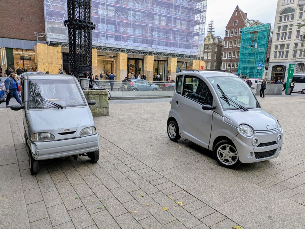Couple of narrow cars in Amsterdam.