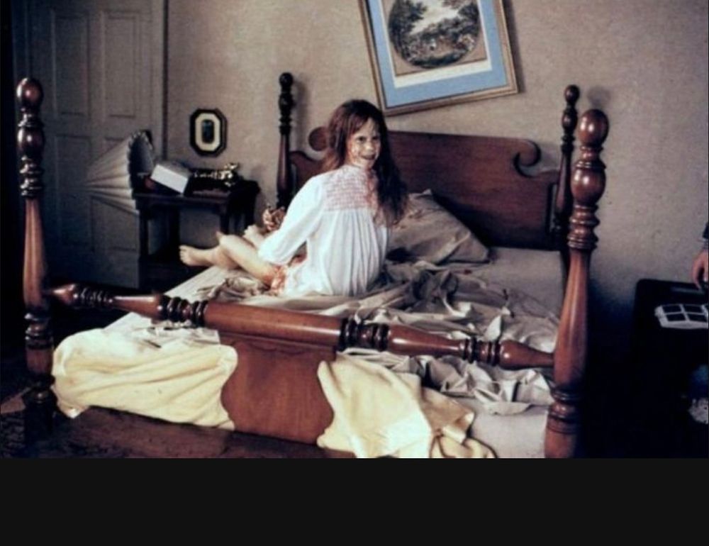 Famous scene from the exorcist in the 4 poster bed. Child actresses head looks like it’s twisted backwards. 
