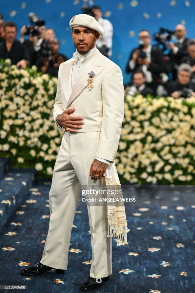 lewis hamilton at the met gala in a custom ivory suit with a beret