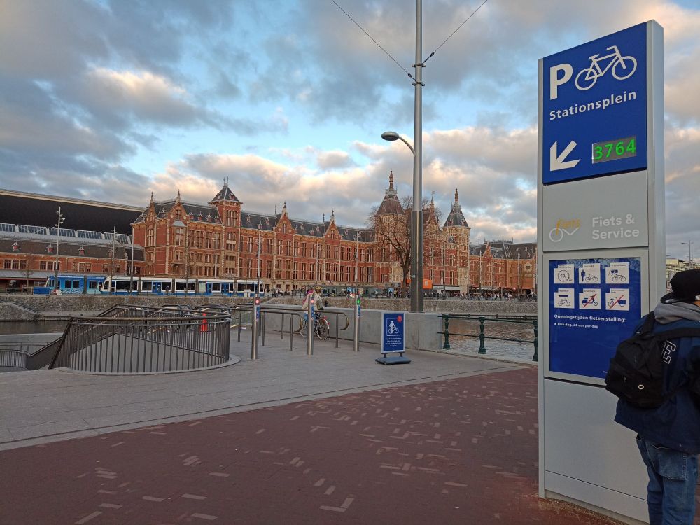 Entrance to the completed bike parking garage, with an electronic sign stating 3764 empty parking spaces 